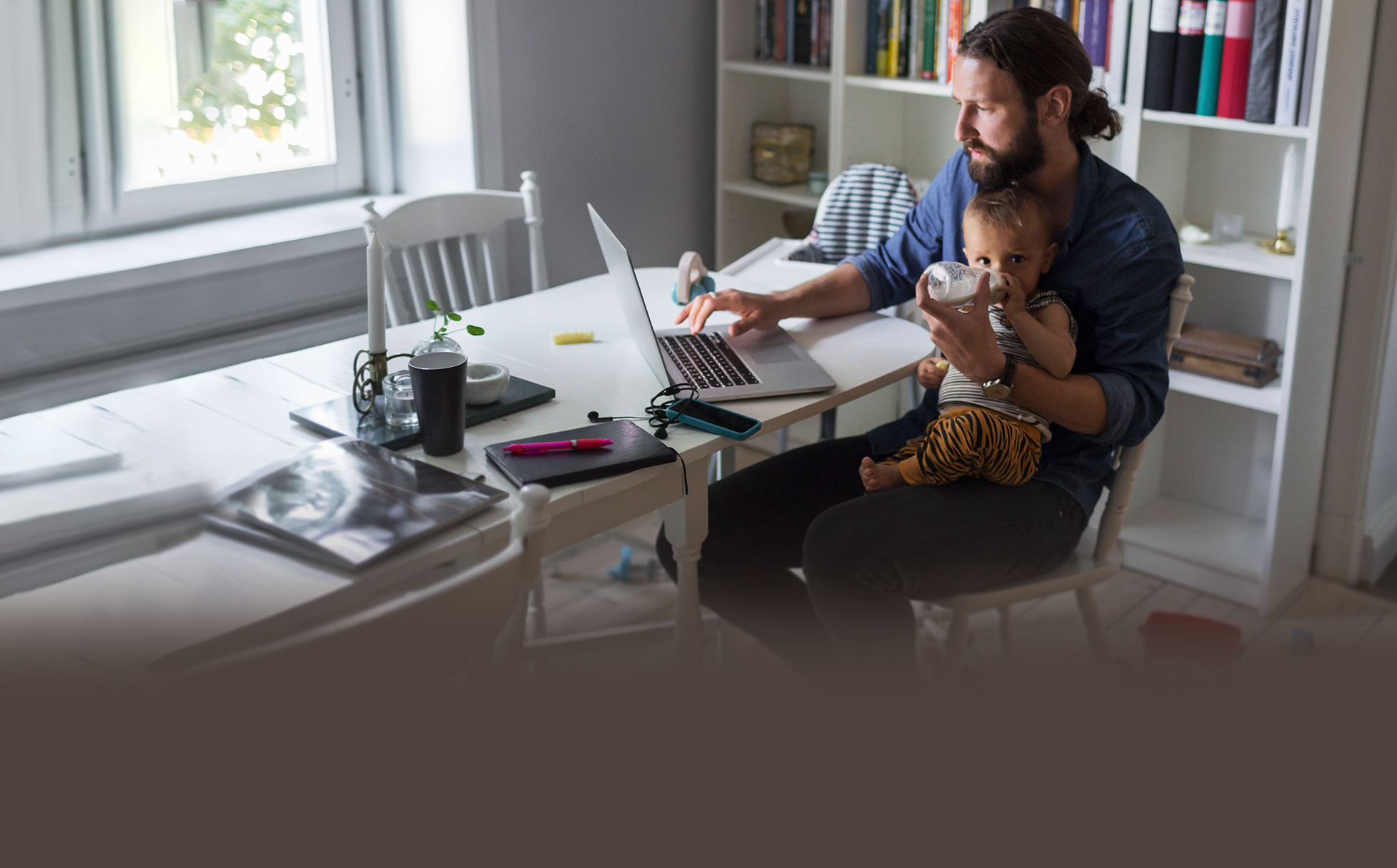 Man working at desk with baby
