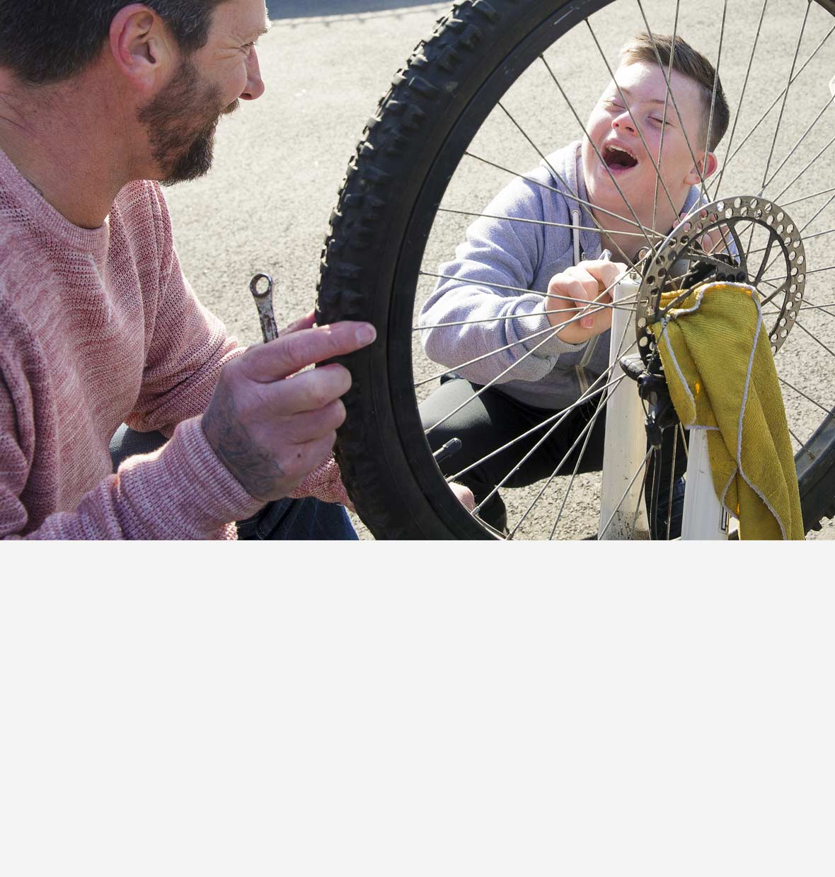 Dad and son fixing a bicycle